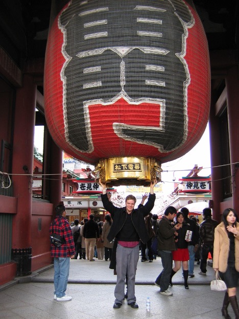 Dean stands under a giant Japanese lantern.